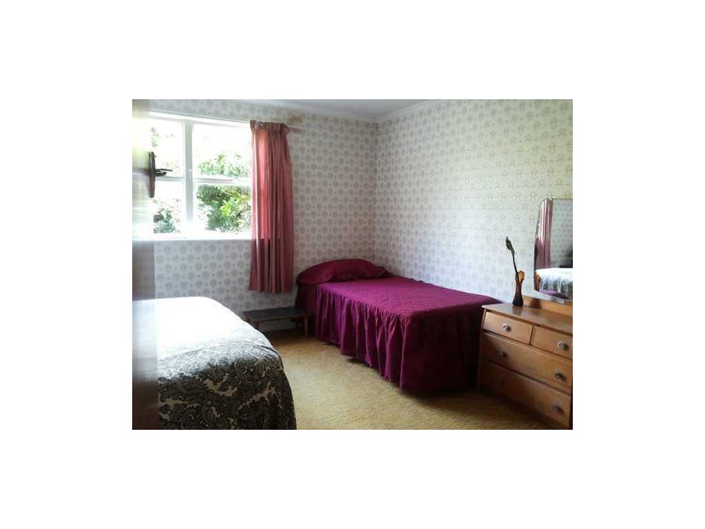 Bedroom with double & single beds Bedroom with double & single beds